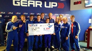 Group of people with a check